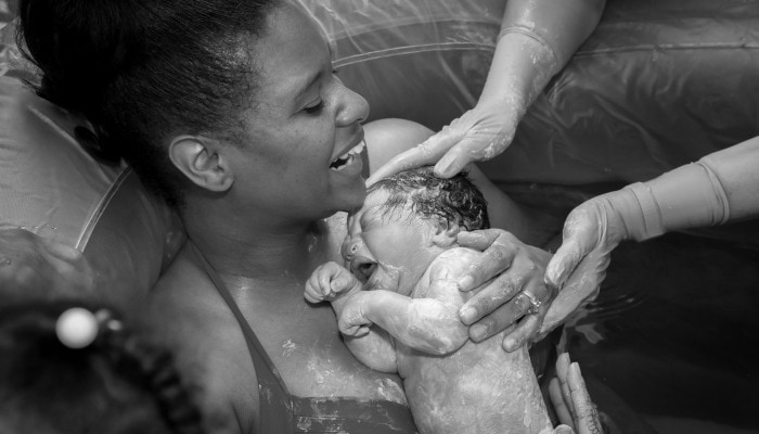 baby placed in mother's arms immediately after water birth