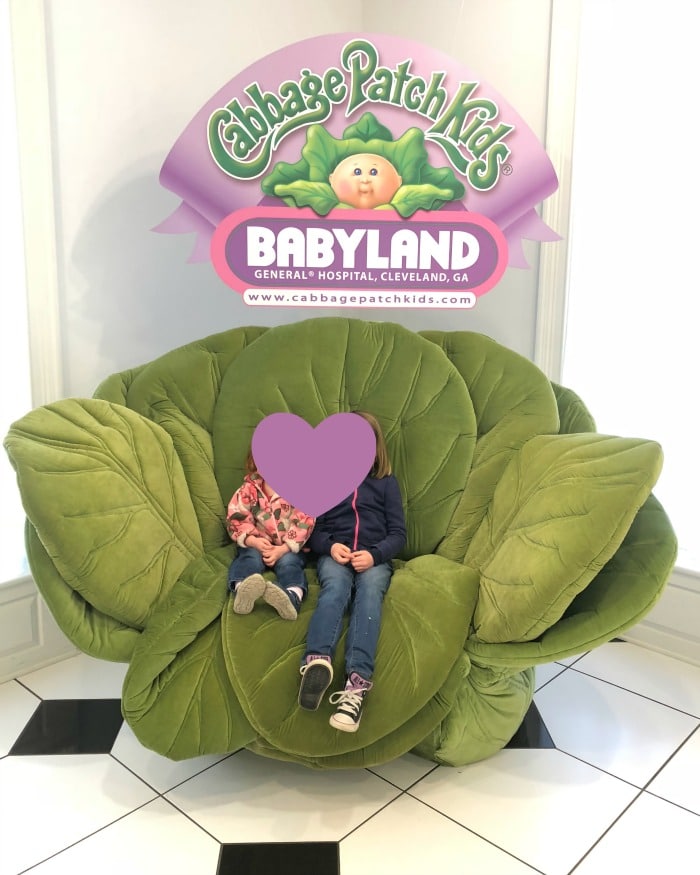 BabyLand photo op in a large plush cabbage. If you're curious about the American birthing culture during the majority of the 1900s, you're in luck.  BabyLand General Hospital, the birth place of the iconic cabbage patch dolls, is a unique time capsule not only for the children of the 80s, but also, unfortunately, the height of the medicalization of childbirth.