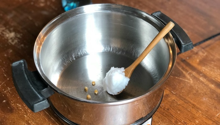 By using my step-by-step instructions you will have perfectly popped coconut oil popcorn made on the stove with minimal (if not zero!) unpopped kernels.  Life goals, people!  Let's get started.