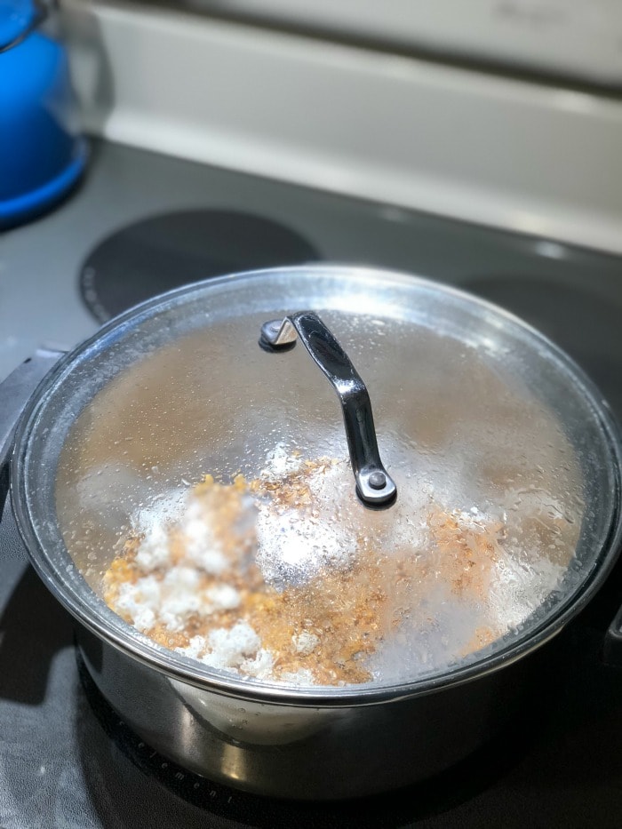 By using my step-by-step instructions you will have perfectly popped coconut oil popcorn made on the stove with minimal (if not zero!) unpopped kernels.  Life goals, people!  Let's get started.