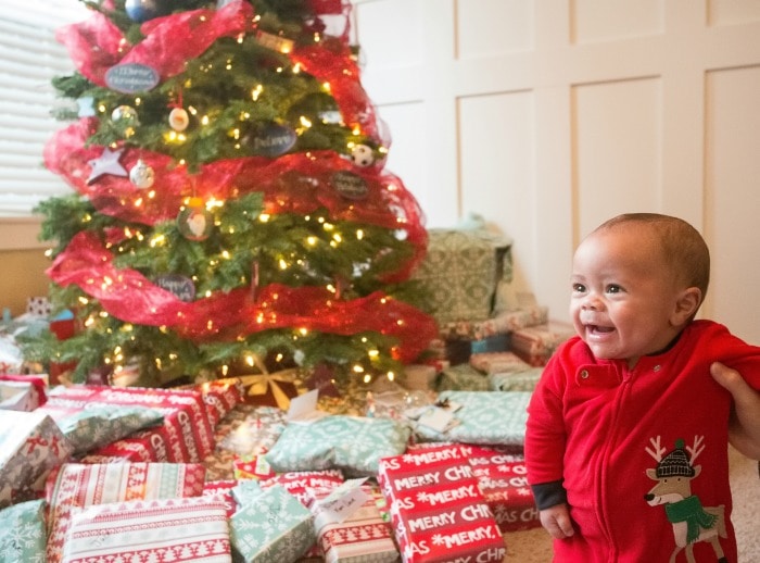 Wherever you're at - mom of a tiny newborn, crawler, or mini-toddler - in this article you'll find practical tips for navigating baby's first Christmas.  #christmas #newborn #postpartumtips #babysfirstchristmas #firstchristmas