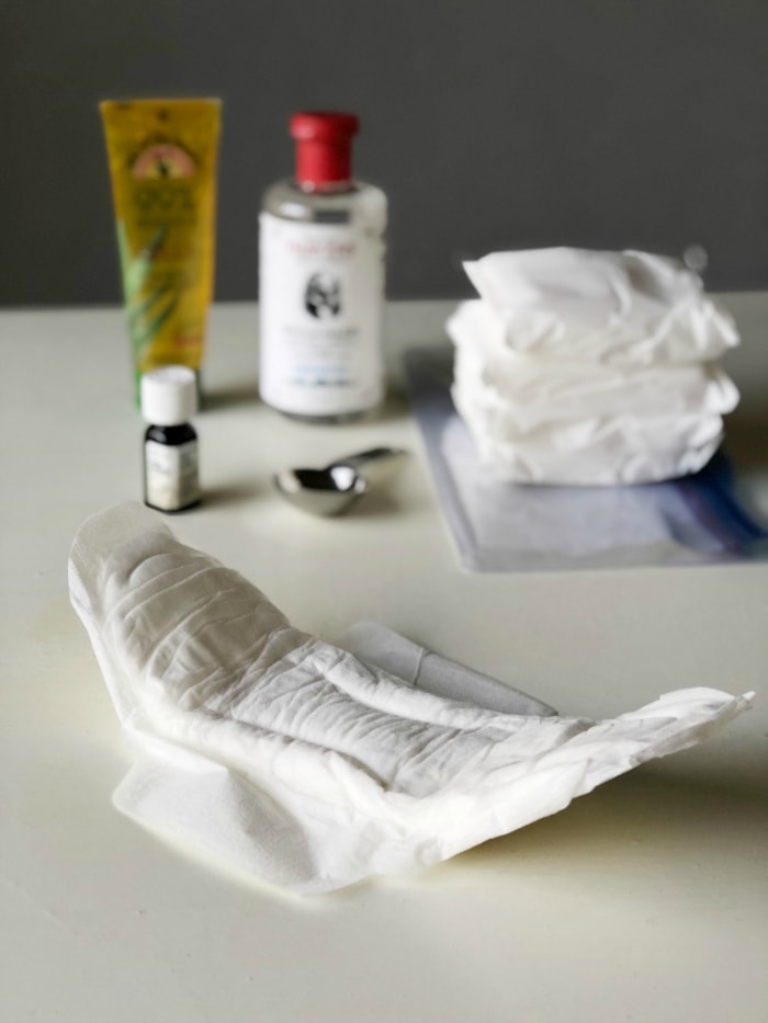 Padsicles are frozen postpartum pads soaked with healing ingredients that are used for pain relief and to promote healing after childbirth. DIY step by step instructions to make these healing pads in the third trimester. #postpartum #diy #pregnancy #thirdtrimester #essentialoils