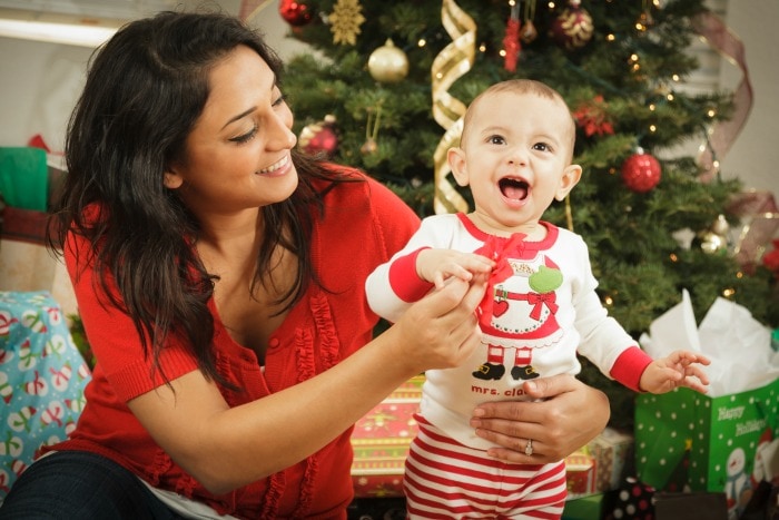 Wherever you're at - mom of a tiny newborn, crawler, or mini-toddler - in this article you'll find practical tips for navigating baby's first Christmas.  #christmas #newborn #postpartumtips #babysfirstchristmas #firstchristmas