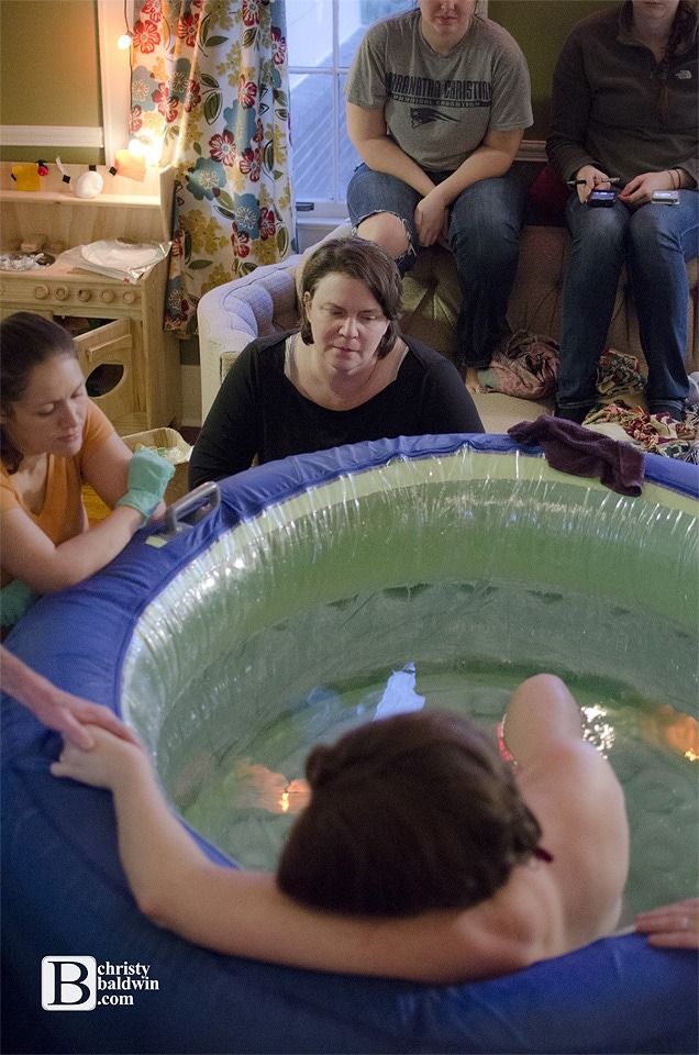 a blogger birth story at home in a tub surrounded by women, a midwife, student midwife